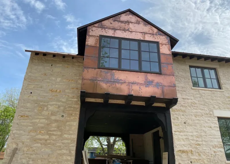 Copper metal panel facade on a stone building for Skylight Installation in Antioch